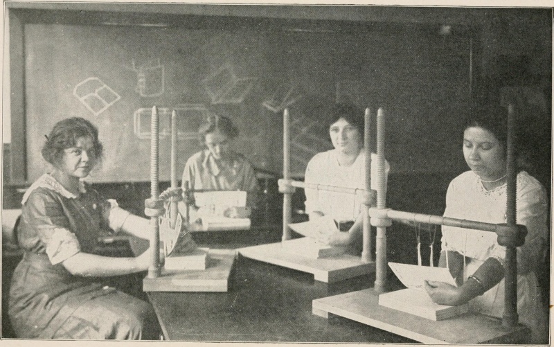 File:Handsewingonframes.jpg